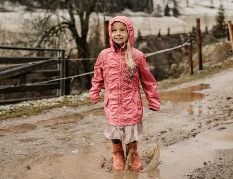  Girl jumps in puddle © Selina Flasch Photography