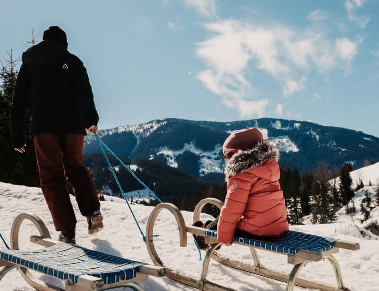  Wooden sleds for walking can be borrowed from the hotel. © Selina Flasch Photography