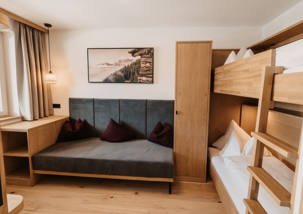 Cozy children's room with a large bunk bed.