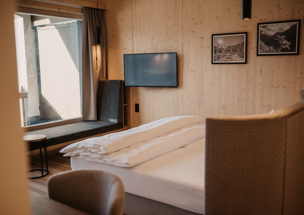 Window seat with a stunning view of the mountain landscape.